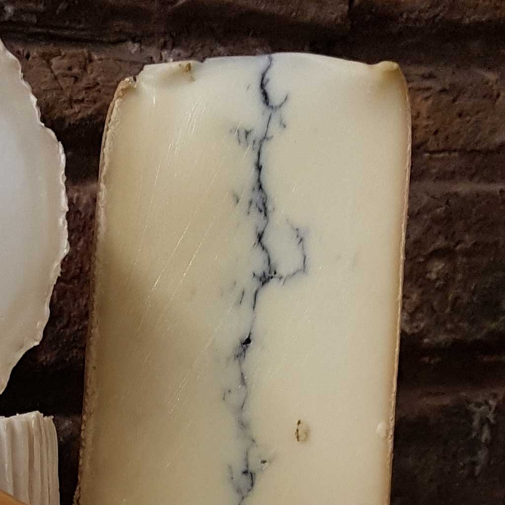 Morbier Cheese, Traditional semi soft french cheese with a layer of ash